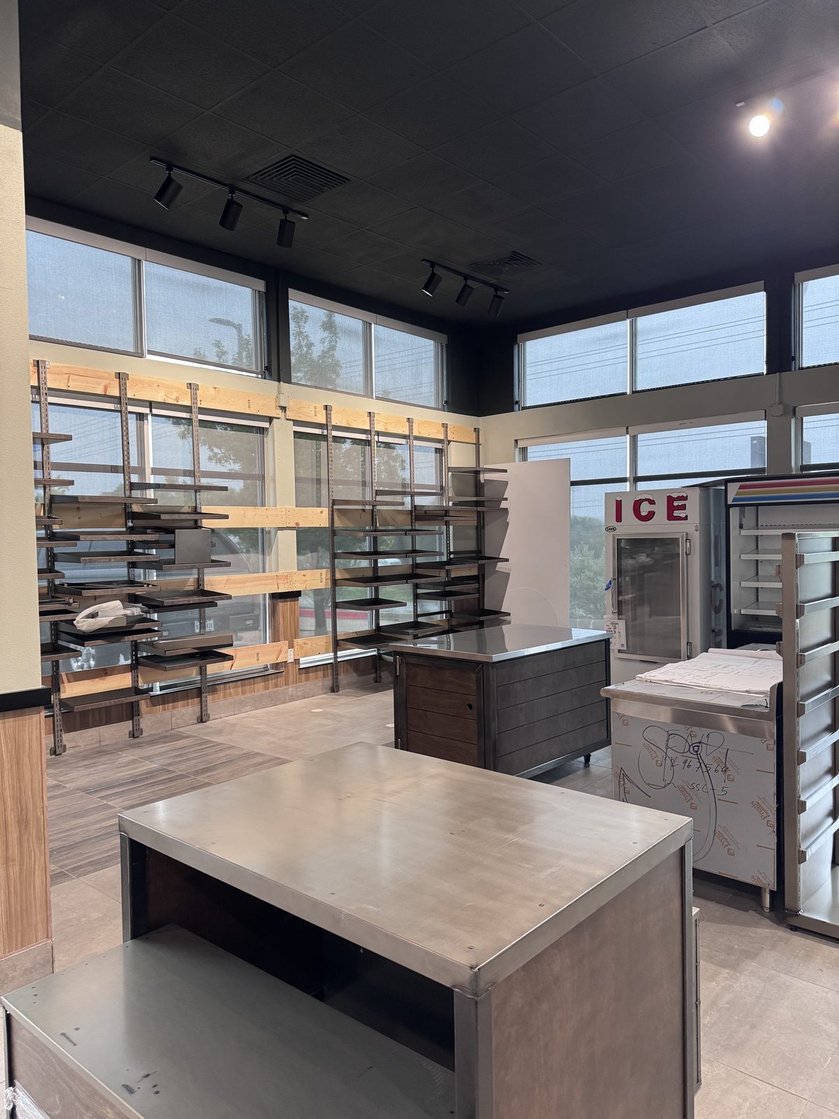 Retail shelving and display tables in the Burnet HTeaO interior